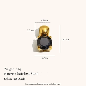 Detail of 18K gold stainless steel cylinder pendant with large round black gemstone
