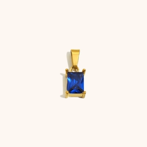 Colgante rectangular de oro de 18K con una piedra de circonita azul talla esmeralda
