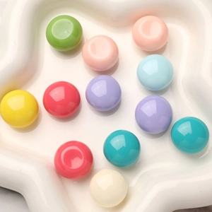 Colorful resin round flatback cabochons in a star-shaped tray for DIY jewelry making