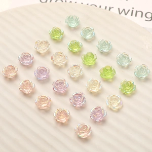 Macro view of 10mm iridescent resin rose flower charms for DIY nail art and crafts
