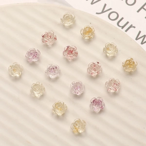 Translucent resin camellia nail charms with gold foil and flower details for DIY nail art