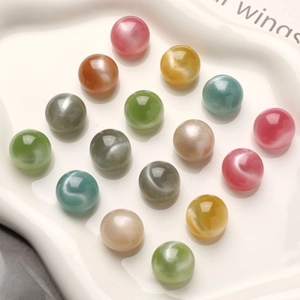 Close-up of 16mm colorful cat-eye resin beads with starry sand effect for DIY jewelry