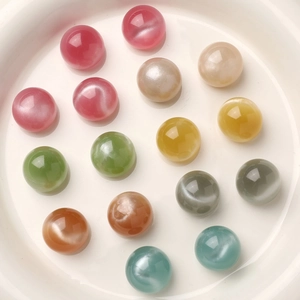 Macro view of 16mm colorful cat-eye resin beads for DIY jewelry and shoe charms