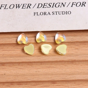 Detail view of mini aurora heart beads for DIY jewelry and nail art crafts