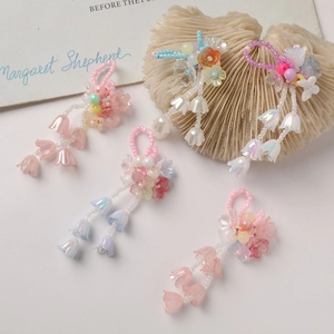 Handmade gradient lily of the valley flower pendants in pastel pink and blue crystal beads
