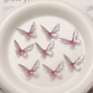 Detail of 8 pink-purple gradient resin butterfly charms with glitter edges for DIY jewelry