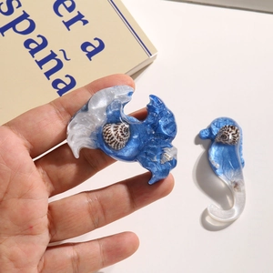 Resin ocean theme hair clips set with sea horse and wave shapes in blue and white