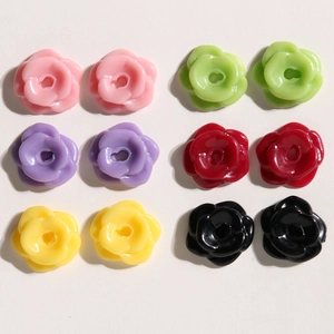 Detailed view of colorful resin rose flower beads with holes for DIY jewelry making