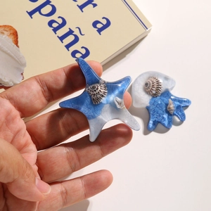 Detailed macro view of resin starfish with real embedded shells for DIY crafts