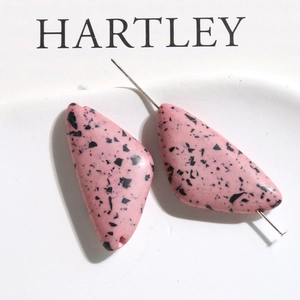 Detail view of pink terrazzo style triangle resin beads for DIY earring jewelry making