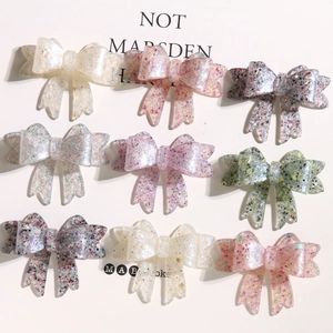 Sparkly candy-colored resin bow accessories with glitter sequins for DIY crafts