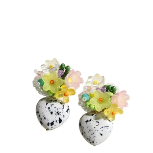 Floral beaded stud earrings featuring a heart-shaped turquoise stone with ink-splatter pattern