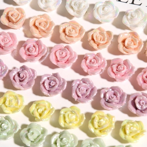 Macro shot of colorful pearlescent resin rose charms for DIY earrings and phone cases