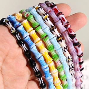 Macro detail of Millefiori glass bamboo beads with flower patterns for DIY jewelry
