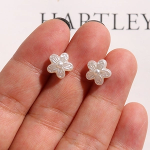 Vintage pearl camellia flower charms for DIY jewelry making held in hand for size