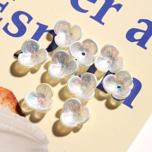 Iridescent white three-petal flower beads for DIY nail art and jewelry crafting