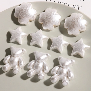 Pearlescent white DIY resin charms in flower, star and bear shapes for hair accessories