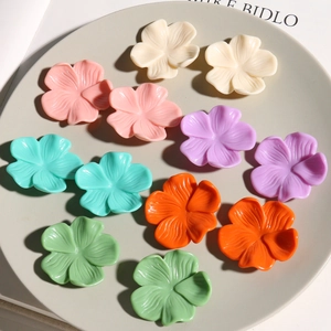 DIY colorful resin flower charms in cream tones for handmade jewelry and accessories