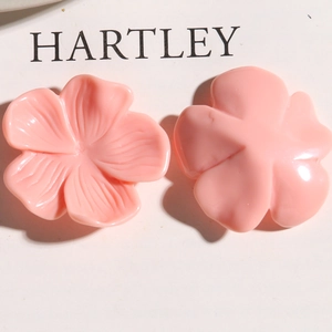 Macro view of pink resin flower DIY accessories showing petal texture and flat back surface