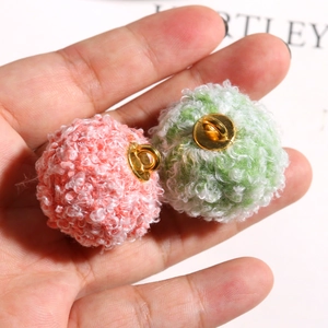 Pink and green fuzzy teddy yarn poms with gold metal bases for DIY jewelry making