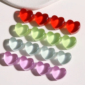 Translucent heart resin cabochons in red, green, and blue for DIY jewelry crafts
