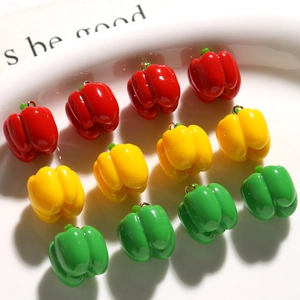 Mini resin chili pepper charms in red, yellow, and green with gold rings for DIY jewelry