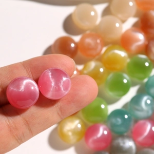 15mm round resin beads with cat eye effect and glitter in multiple vibrant colors