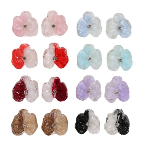 Set of eight pairs of translucent resin flower charms with small rhinestones in varied colors
