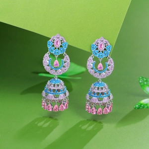 Elegant silver Jhumka earrings with pink and blue zircons on green background
