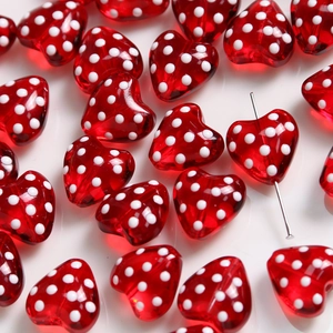 Red heart-shaped glass beads with white polka dots for DIY jewelry making and crafts