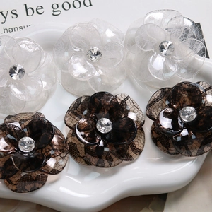 Floral acetate hair clips with lace pattern and rhinestones in black and white colors