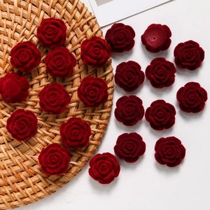 Macro detail of wine red flocked rose flower heads for DIY jewelry and hair accessories