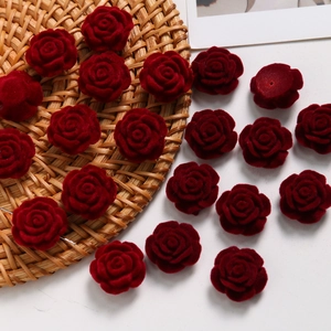 Macro shot of 2cm burgundy velvet rose heads for DIY jewelry and clothing accessories