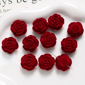 Macro detail of deep red flocked rose beads for DIY jewelry and handmade accessories