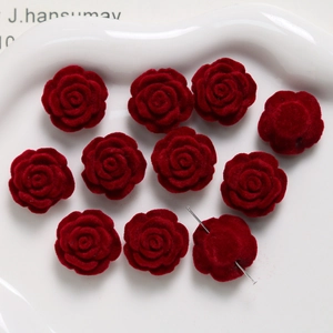 Macro detail of wine red flocked rose flower heads with visible holes for DIY jewelry