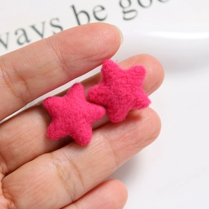 Macro view of plush rose pink felt star DIY accessories for hair clips and phone cases