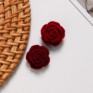 Detailed view of deep red flocked rose accessories for DIY jewelry and hair crafts