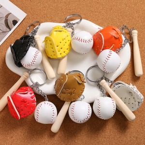 Detailed view of mini baseball glove and wooden bat keychain set in multiple colors