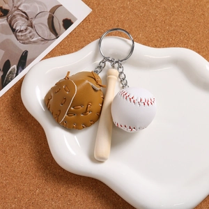 Miniature baseball keychain with leather glove, wooden bat, and white ball detail