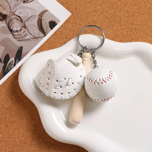 Detailed view of the mini baseball keychain with leather glove and wooden bat charms