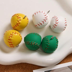 Miniature baseball keychain charms in yellow, white, and green with faux stitching