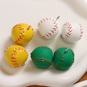 Macro view of mini baseball keychains in three colors with realistic red stitching