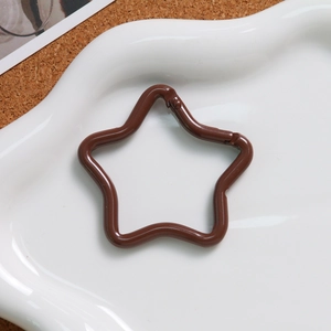 Detailed view of a dark coffee star-shaped spring clasp for DIY keychain accessories