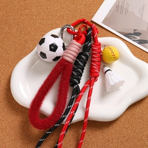 Mini sports keychain set with football, softball, and shuttlecock on a red carabiner