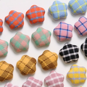 Close-up of colorful checkered star fabric patches with detailed woven textile texture
