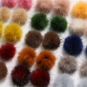 Close-up of assorted 3.5cm colorful mink fur pompoms for DIY jewelry and hair accessories