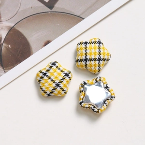 Star-shaped button with yellow and black plaid fabric cover for DIY hair accessories