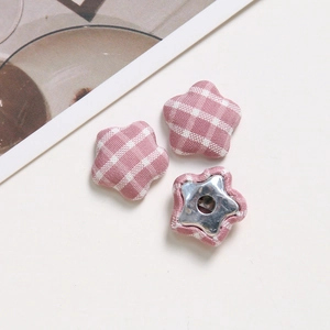 Detail of pink plaid fabric star buttons with metal backing for DIY hair accessories