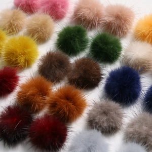 Macro shot of 3.5cm colorful mink fur pom-poms with soft texture for DIY hair accessories