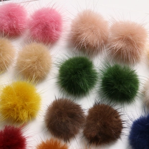 Macro shot of colorful 3.5cm faux fur mink pom-poms with soft and dense fiber texture